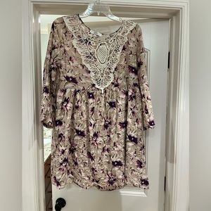 Entro tunic. Size medium. Cream color with purple floral pattern.